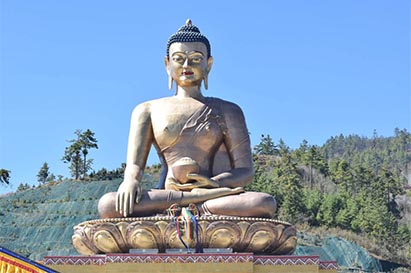 Buddha bronze statue under clean sky