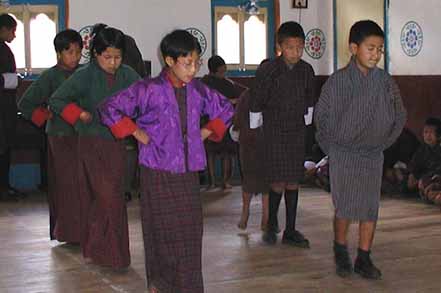 students standing in colorful outfit