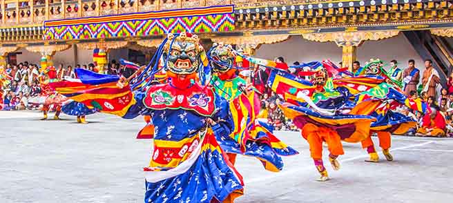 mask dances wearinf colorful outfit