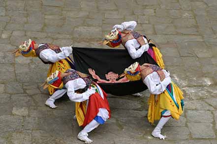 four people mask dancing