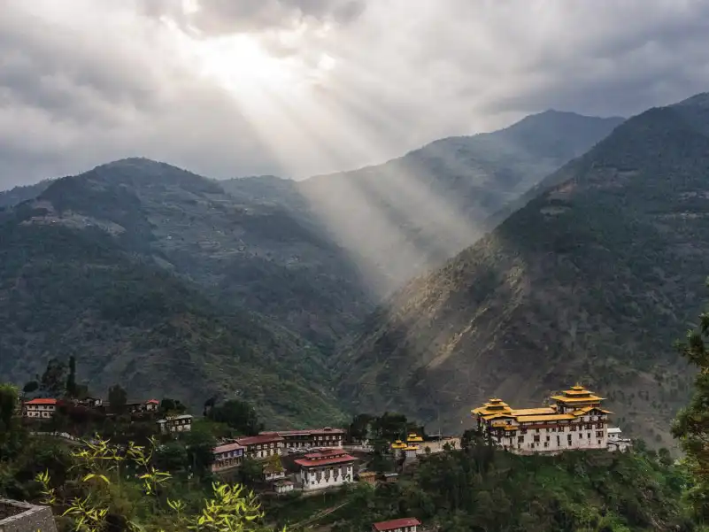 dzong covered with trees and sunrise