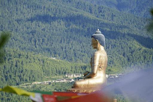buddha statue behind mountain